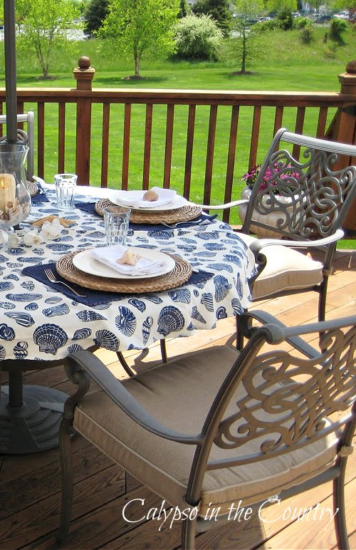 Patio table with blue shell tablecloth