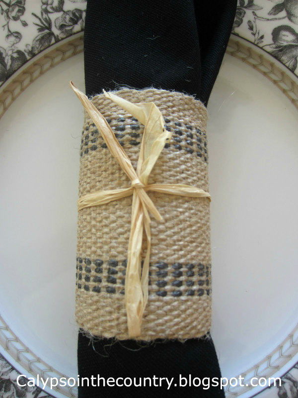 jute napkin ring on black and white plate