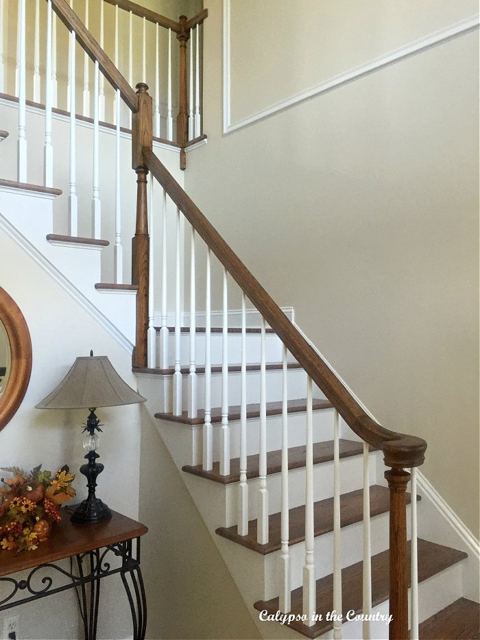 White sand paint in foyer with staircase