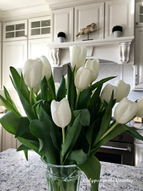 white tulips in white kitchen - ways to decorate with tulips