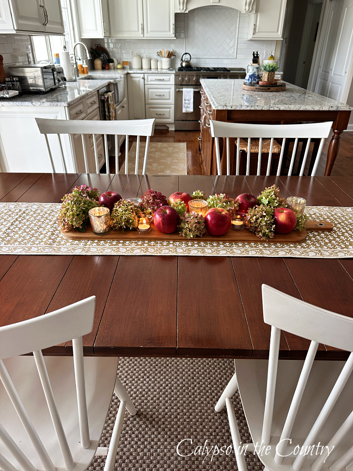 apple and hydrangea centerpiece on kitchen dining table - decorating with apples