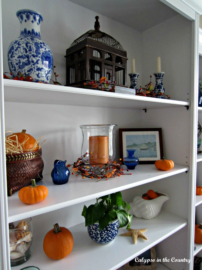 Orange pumpkins and blue and white for fall