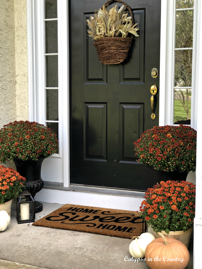 Simple Fall front porch decor with orange and black