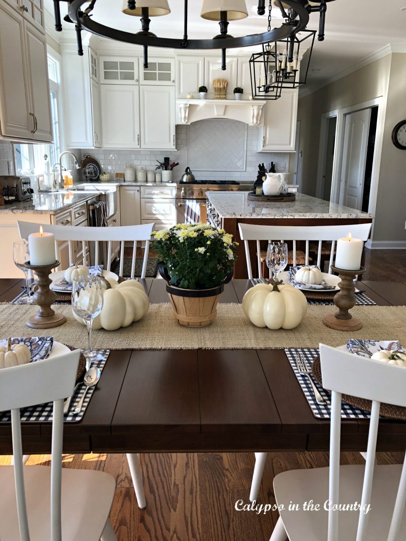 fall kitchen tablesetting with white pumpkins