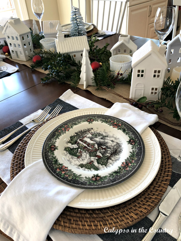 Christmas Table with White Ceramic Village and holiday plates