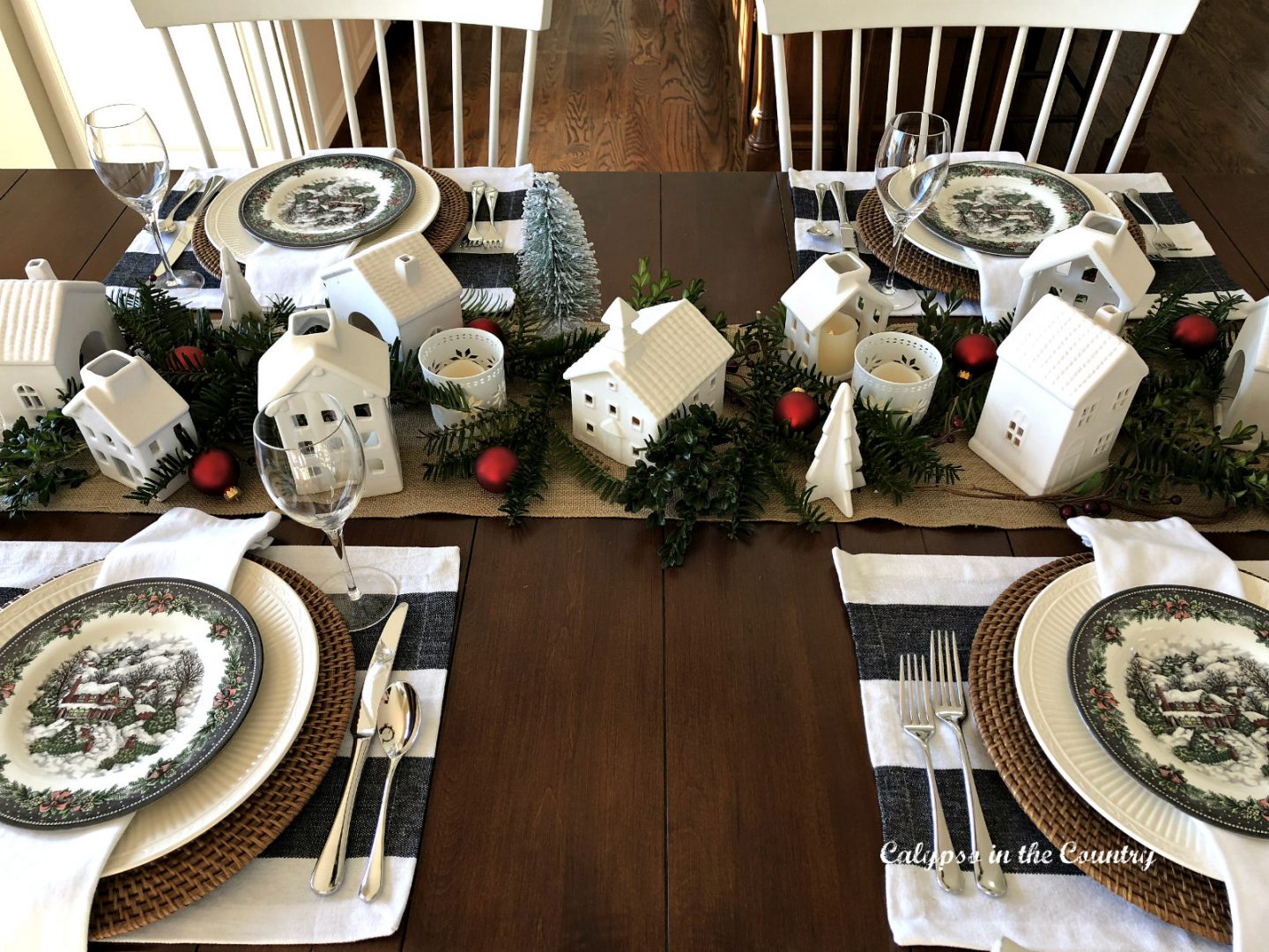 small white ceramic Christmas houses on table