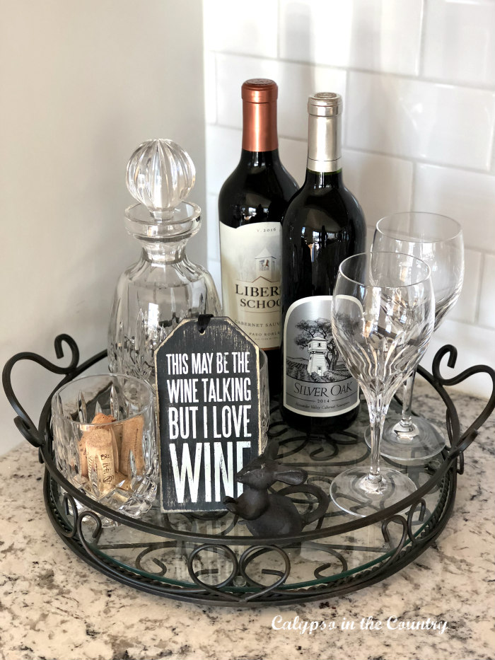 Glass tray with wine bottles and glasses