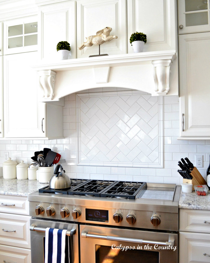 white cabinets over stove with bunny - ways to bring spring into your home