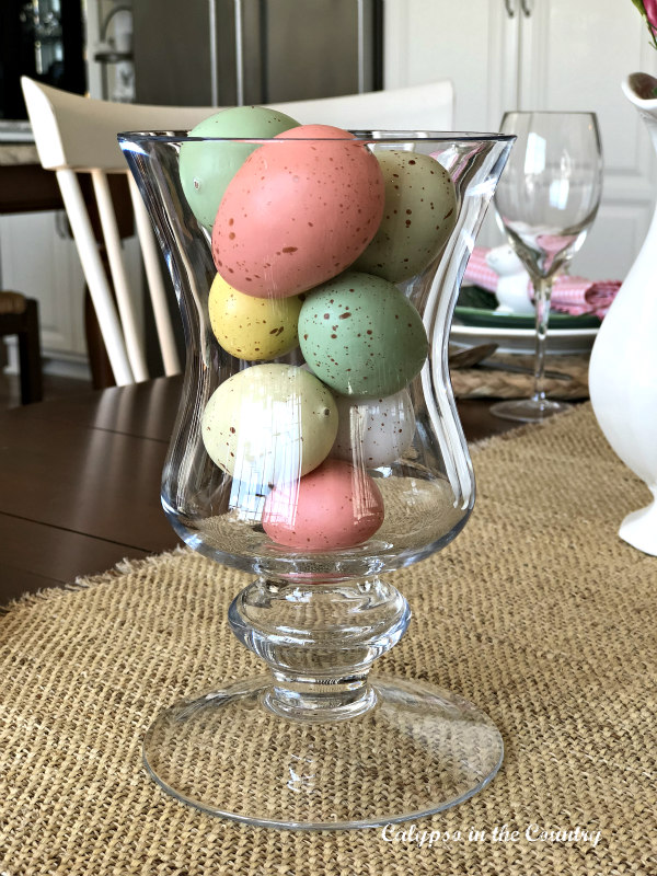 Colored Easter Eggs in glass hurricane