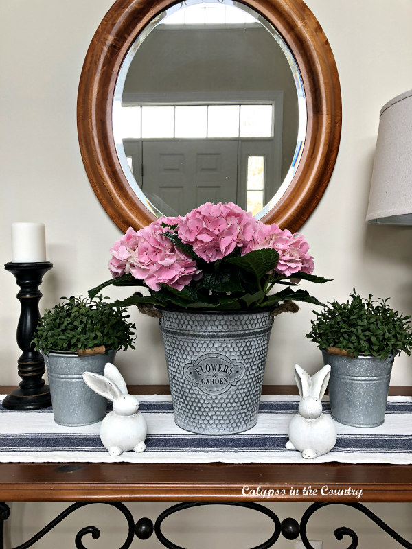 Decorating with Pink Hydrangeas in foyer for spring 