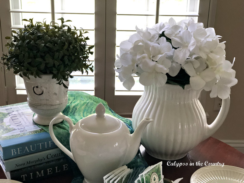 white teapot and flowers on table - spring afternoon tea ideas 