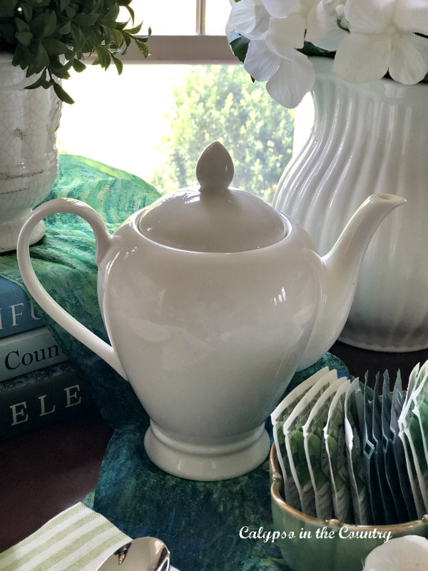 White teapot and tea bags - spring tea party 