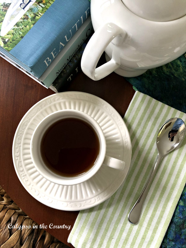 cup of tea, spoon and striped napkin - spring afternoon tea