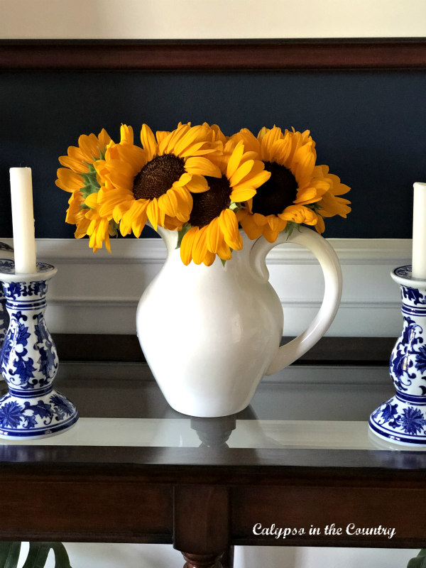 sunflowers in white pitcher - decor ideas to transition from summer to fall