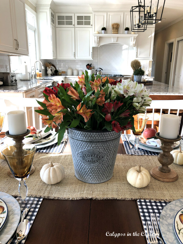 Colorful flowers in galvanized bucket for a casual Thanksgiving table setting