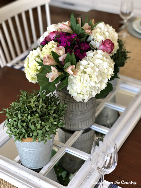 spring flower centerpiece on a mirror