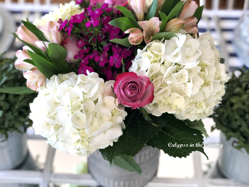 Spring flowers in metal container