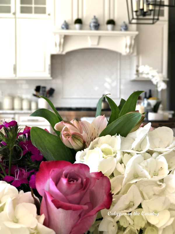 Spring flowers in white kitchen