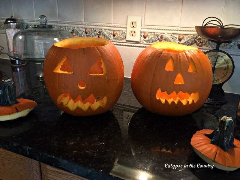 Two Jack-o-lanterns on counter - Halloween Inspiration