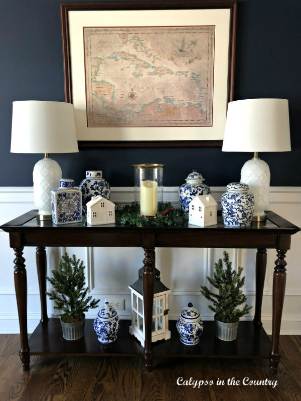 White Ceramic Christmas Houses in Navy Dining Room