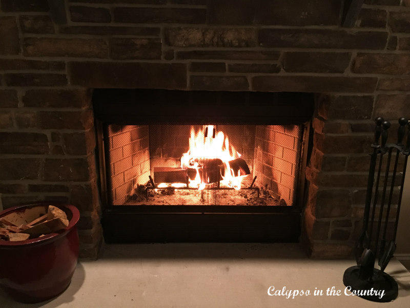 fire in stone fireplace