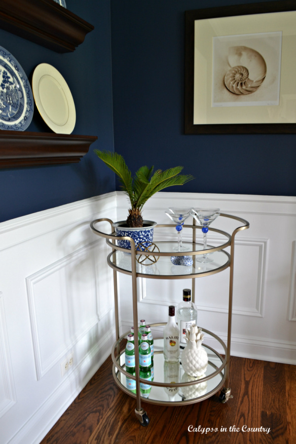 Gold Bar Cart decorated with blue and white spring accessories