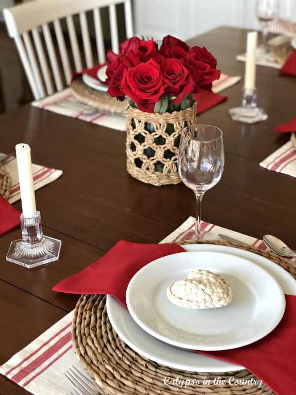 Red and white table decor with seagrass accessories