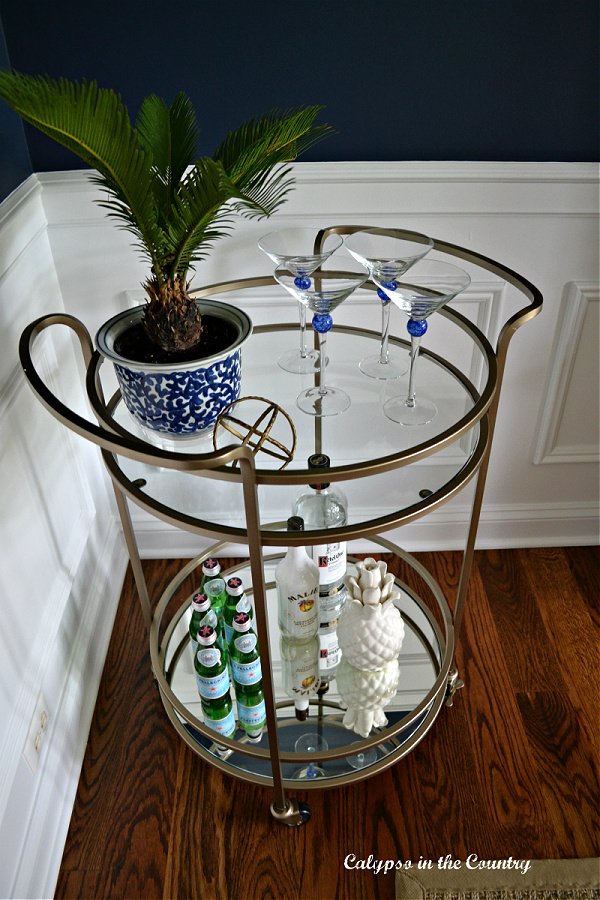 round gold bar cart with blue and white for spring