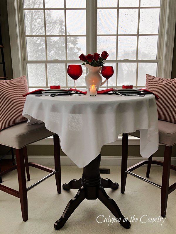 Pub table with white tablecloth for a Valentine's Day Table Setting