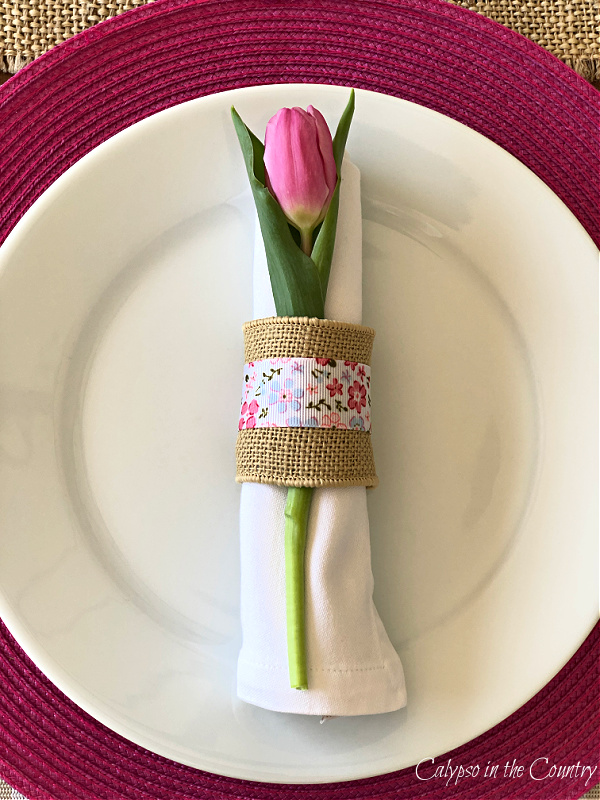 Pink tulip in burlap napkin ring