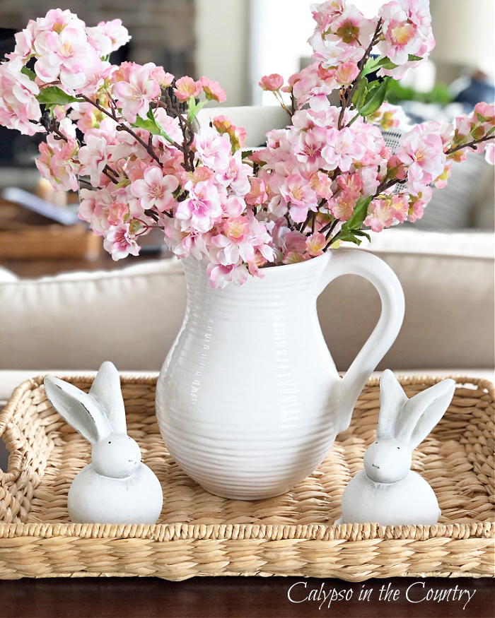 Pink Cherry Blossoms in white pitcher on seagrass tray - Pretty Pink Home Decor Ideas