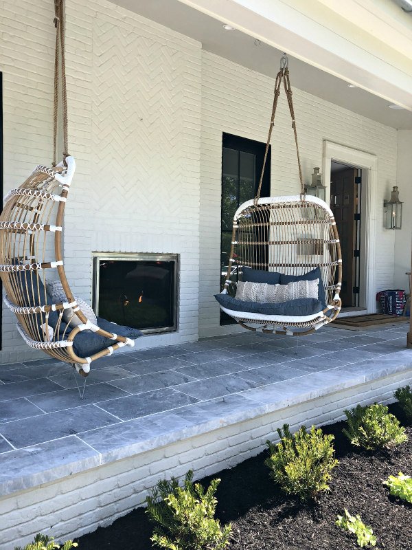 Hanging porch swings and outdoor fireplace - outdoor living space ideas