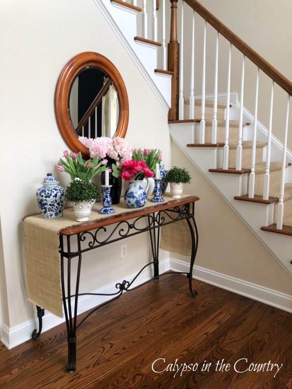 Foyer table with mirror - how to decorate an entry table for spring