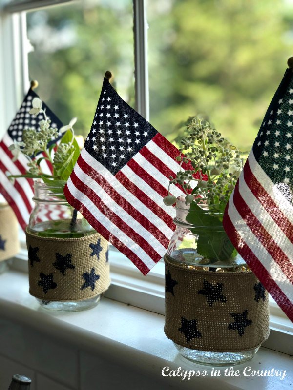 Flags and mason jars on windowsill - patriotic home decor ideas