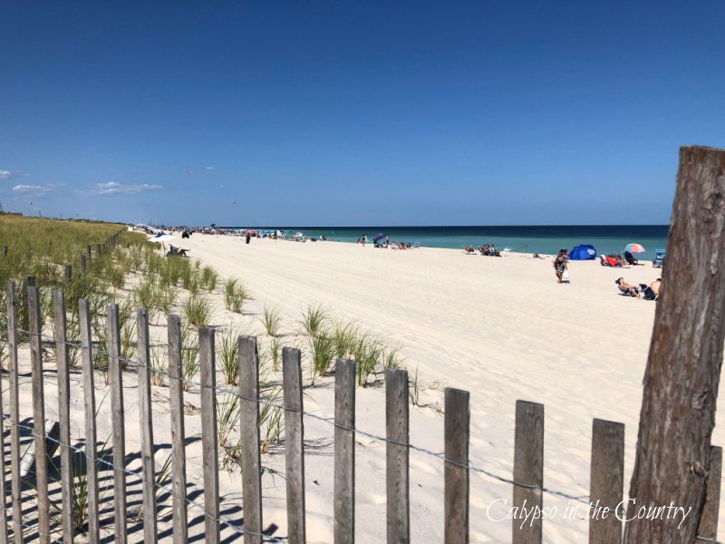 Sunny beach and fence - make the most of summer