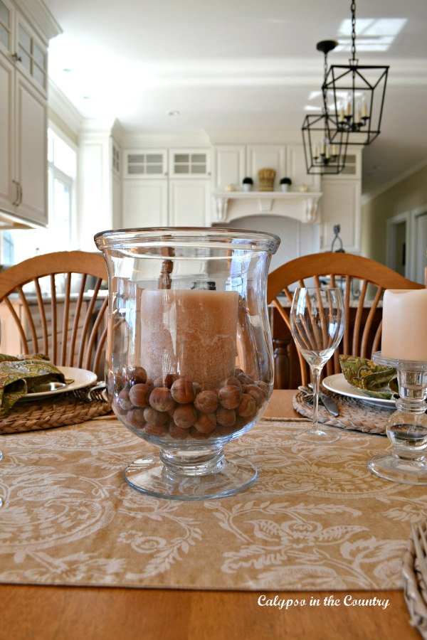 Hurricane with hazelnuts and candle - easy and cheap Thanksgiving table centerpieces