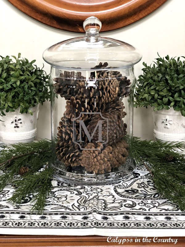 Pine cones in glass apothecary jar - easy vase filler ideas for Christmas