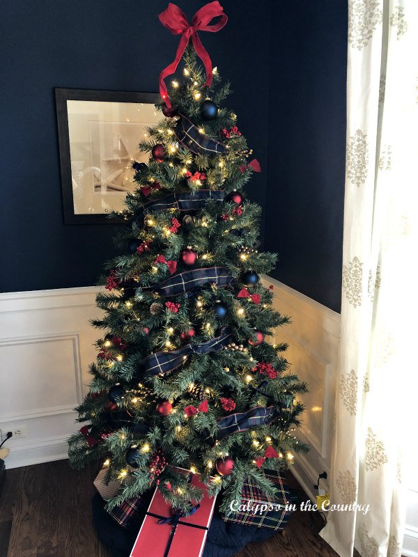 Christmas tree with red and blue ornaments - simple holiday traditions