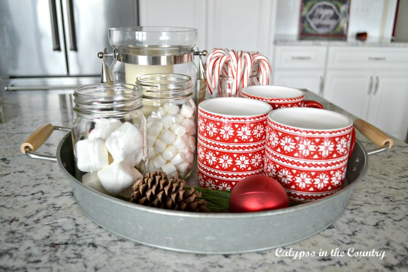 marshmallows in mason jars with red mugs - easy vase filler ideas for Christmas