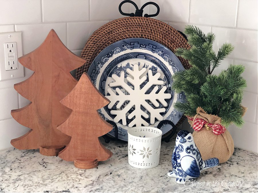 Blue and white decor and trees on counter - classic and cozy Christmas decor