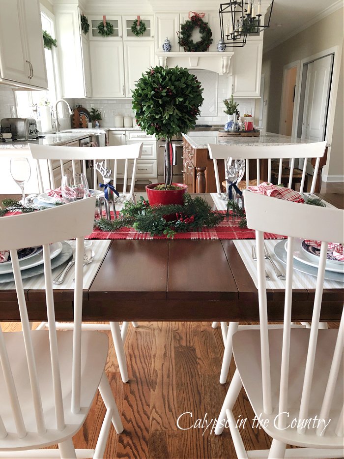 kitchen table with white windsor chairs - classic and cozy Christmas house tour