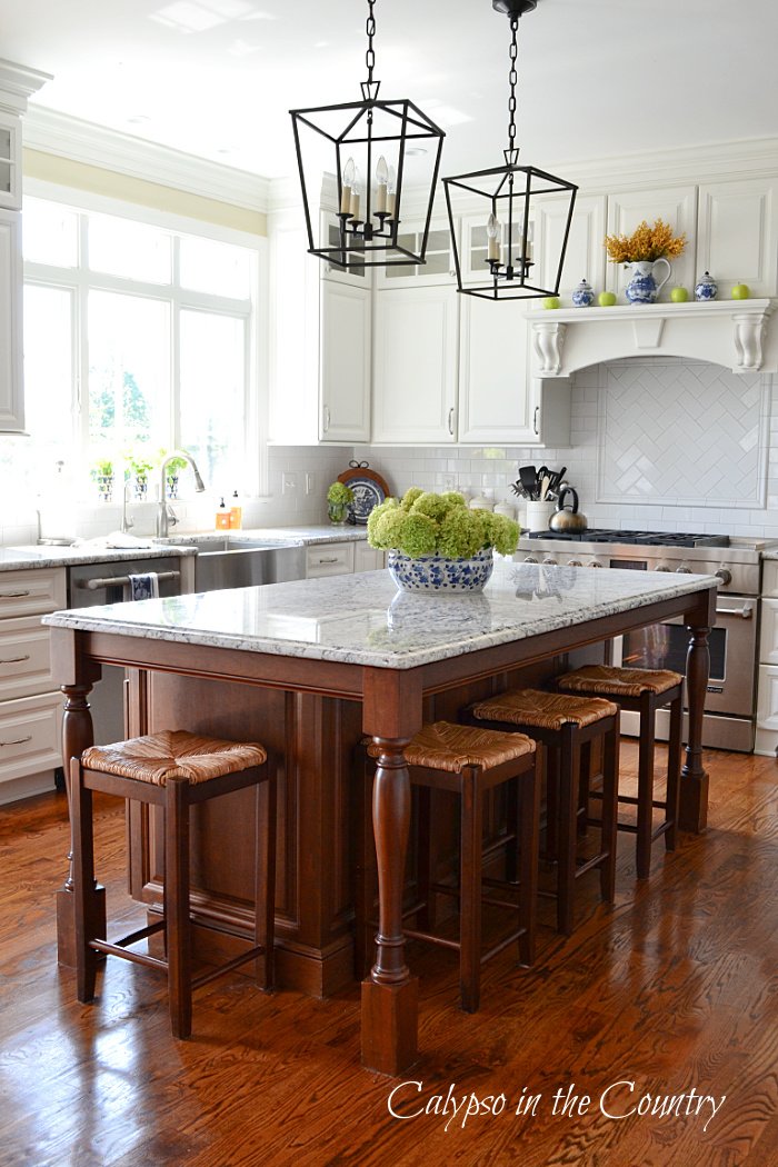 white kitchen with stained wood island - most popular blog posts of 2021