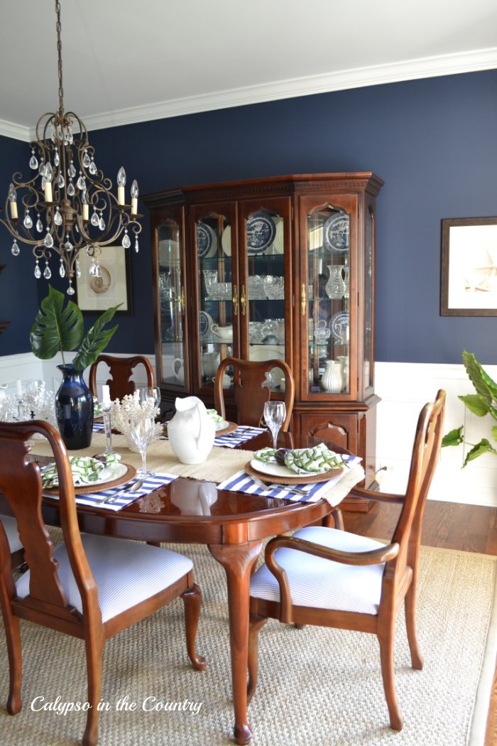 Navy dining room with timeless cherry furniture