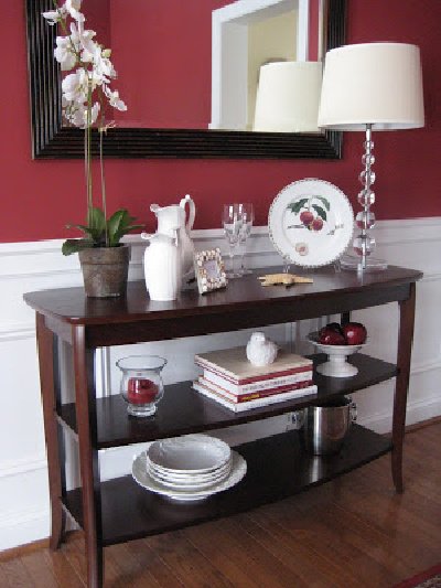 Valentine's Day console table in front of red walls