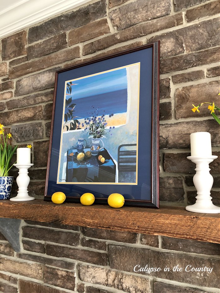 Stone fireplace decorated for spring with blue and yellow