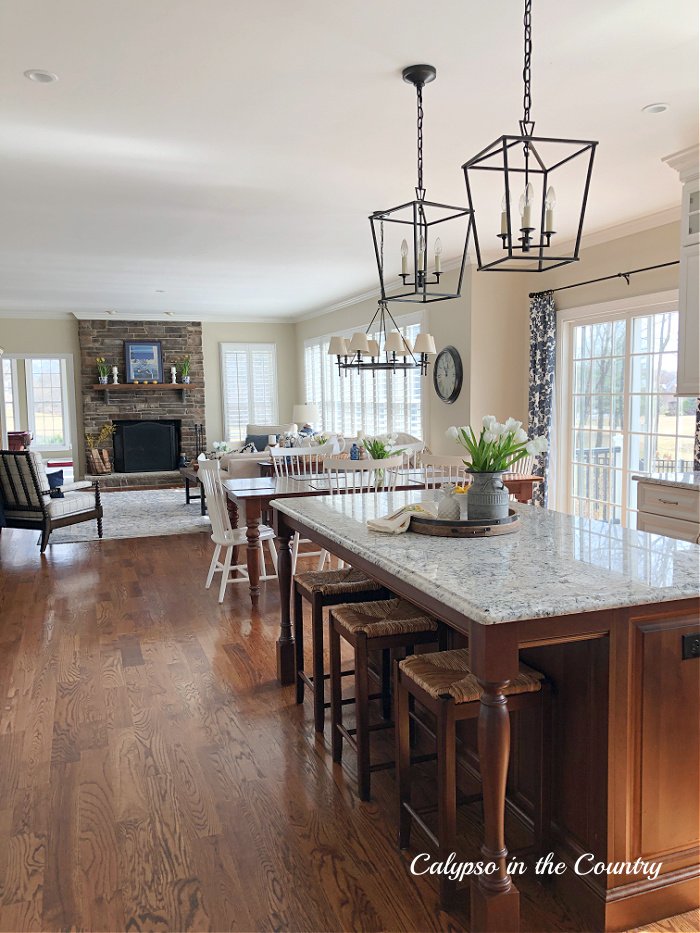 Open concept kitchen and family room decorated for spring