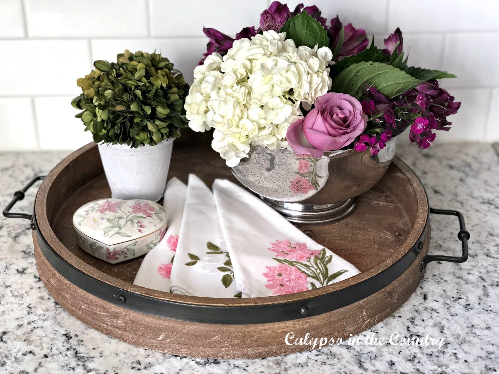 round wood tray with flowers