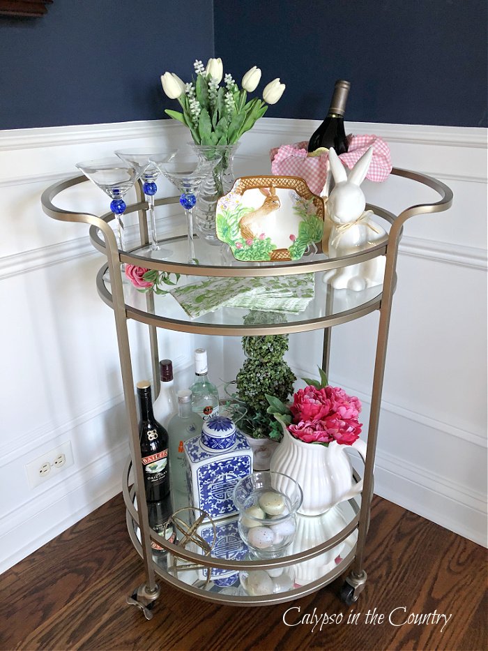 Round bar cart decorated for Easter with pink, green and blue - Easter decorations ideas