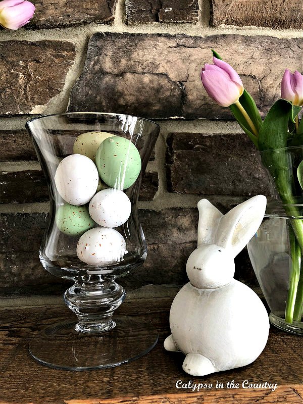White Easter bunny and a vase full of Easter eggs - hello April ideas