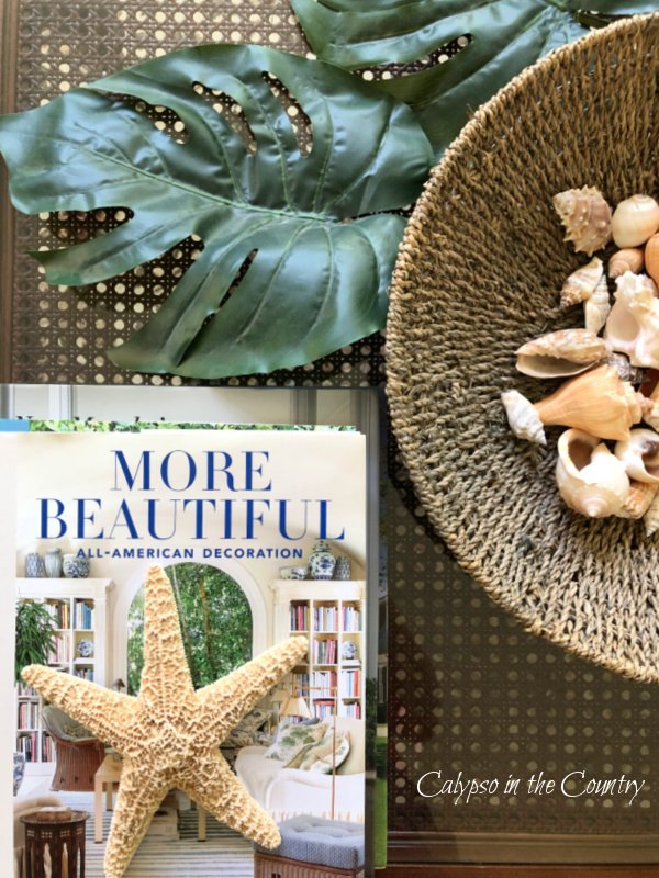 faux greenery and books on coffee table